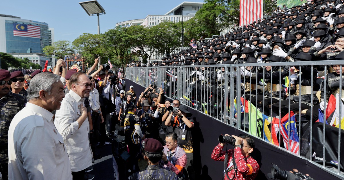 Anwar offers personal touch after National Day parade, embracing children at public walkabout