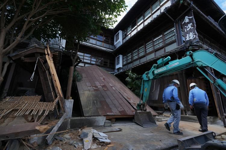Heat stroke claims elderly woman sheltering in car as Japan quake death toll reaches 36
